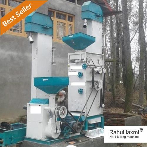 A Jeevan Mini Rice Mill Plant in a crisp white and blue color scheme, comprising essential components such as a dehusker, rice polisher, rice grader, rice separator, and two elevators. The clean and modern design of the plant is accentuated by the refreshing white and blue tones, creating an efficient and visually appealing rice milling setup. The dehusker ensures the removal of husks, followed by the polishing, grading, and separation processes, all seamlessly integrated. Two elevators facilitate the smooth transfer of materials. This comprehensive and aesthetically pleasing rice mill plant embodies functionality and sophistication in its design, ideal for optimized rice processing."